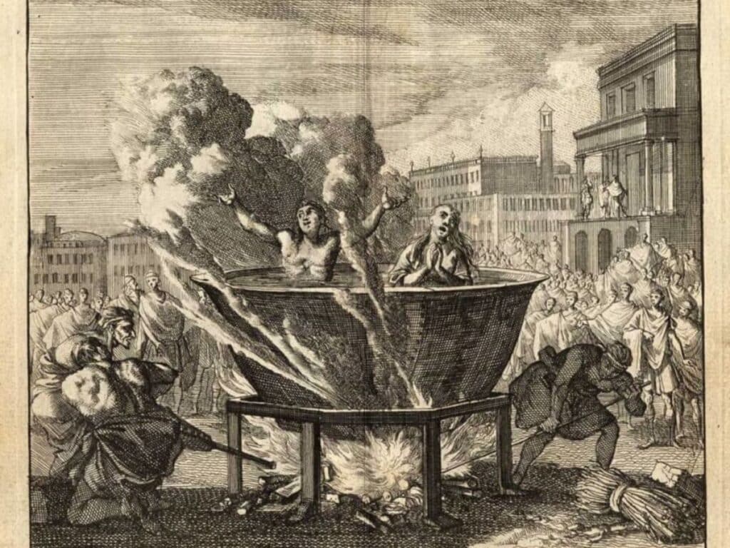 A dramatic medieval engraving showing two people submerged in a massive boiling cauldron over open flames, surrounded by a crowd, vividly depicting the brutal "trial by ordeal" punishments tied to the harsh laws you'd never want to break in the Middle Ages.