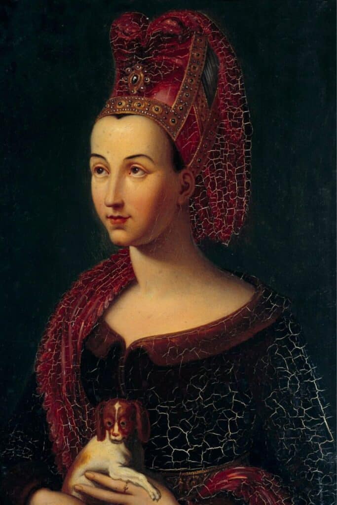 A Renaissance-style portrait of Margaret of Burgundy, née Margaret of Flanders, dressed in an ornate red headdress and gown, known for supporting Perkin Warbeck’s bid to pose as Richard of Shrewsbury.