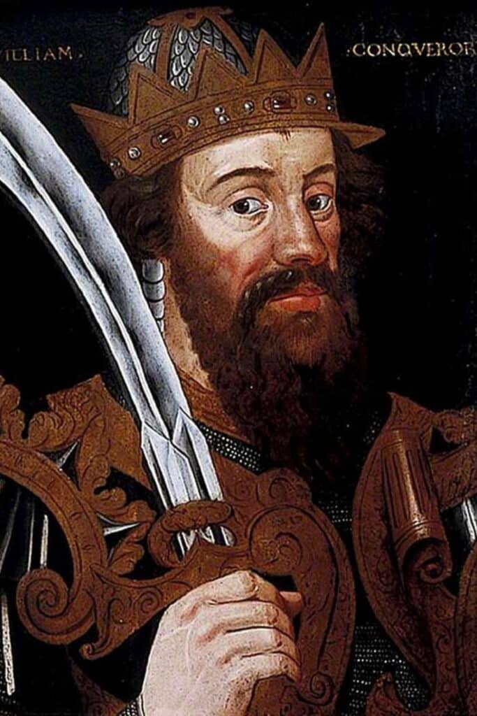Portrait of William the Conqueror in a decorated crown and armor, holding a sword, commemorating his victory at the Battle of Hastings and rise as the first Norman king of England.