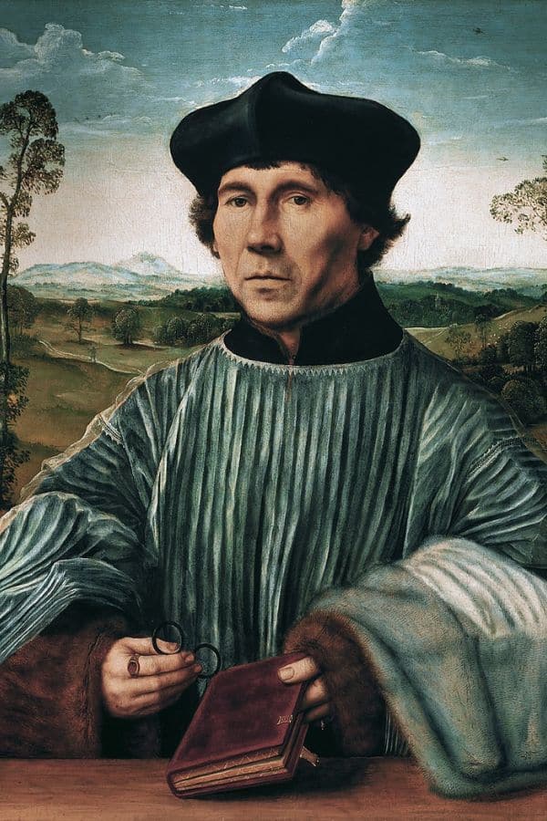 Portrait of a solemn man in Renaissance attire holding a small book and eyeglasses, with a rural landscape in the background. His style and setting reflect the 16th-century context of Catherine Parr's time.