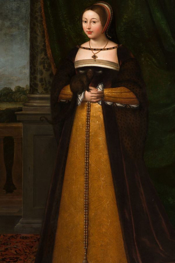 A full-length portrait of a noblewoman in a rich mustard gown with fur trim and a jeweled necklace, historically styled to represent Margaret Tudor or a woman of her court.