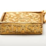 Detailed side view of the Hockley Pendant highlighting the engraved name 'BALTASAR' in bold medieval lettering.