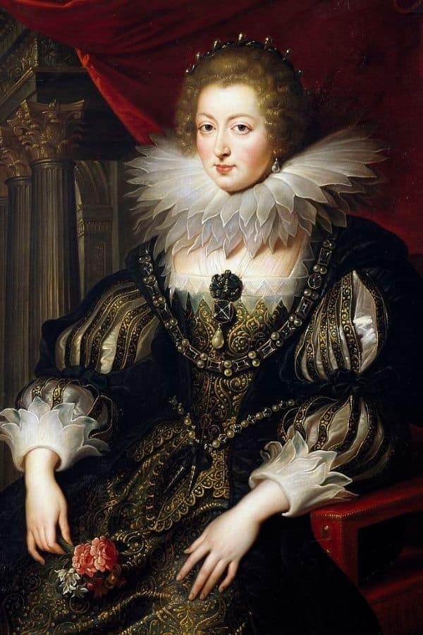 Anne of Austria seated in a richly decorated gown with puffed sleeves, intricate gold embroidery, and a large lace ruff around her neck.