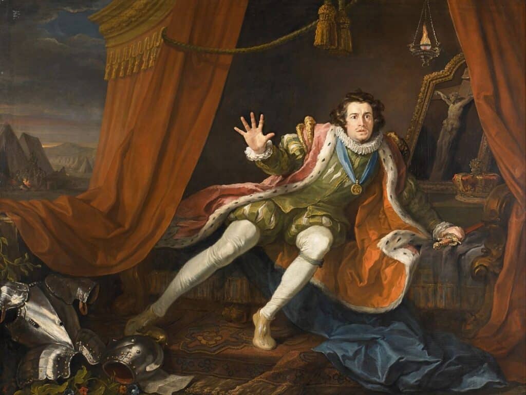 Painting of Richard III recoiling in fear inside a tent, wearing a crown and royal robes with armor scattered on the ground and a crucifix in the background.