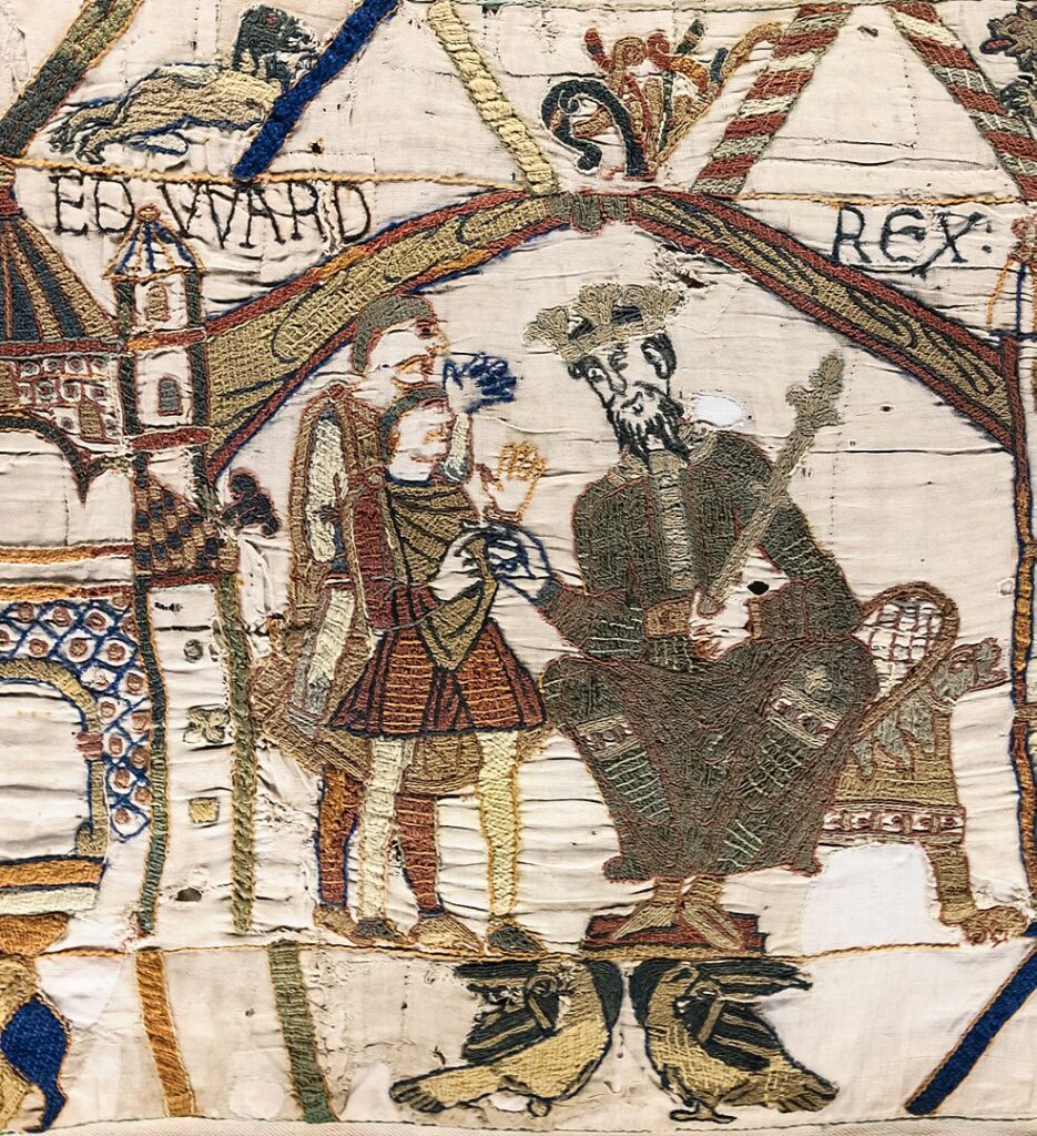 Detail from the Bayeux Tapestry showing King Edward the Confessor seated on a throne with two attendants, labeled "EDWARD REX".