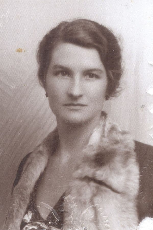 Vintage portrait of Virginia Hall in a fur-trimmed coat, highlighting her elegance before becoming one of the most effective spies of World War II.