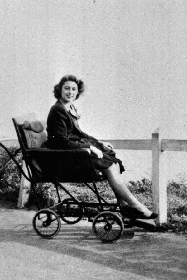 A young Violette Szabo sits in a stroller, smiling while dressed in a smart coat and heels. Even early on, Violette Szabo carried a poise that would later define her legacy.