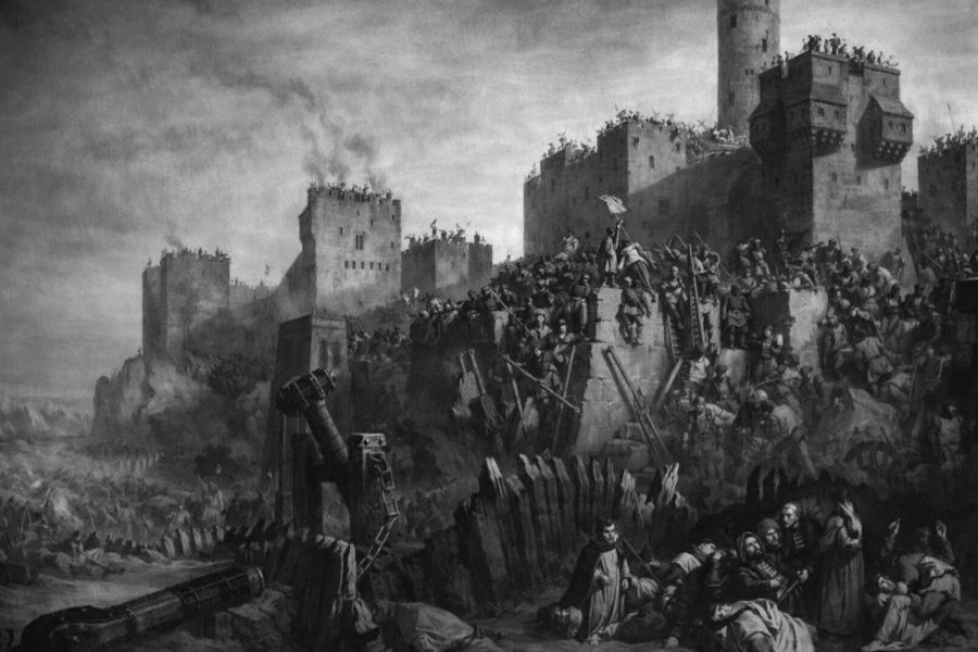 A black and white painting of a violent medieval siege with chaos at the castle walls as soldiers climb ladders and defend against invaders. This historical battle imagery connects to the era and conflicts faced by Jacques de Molay and the Templars.