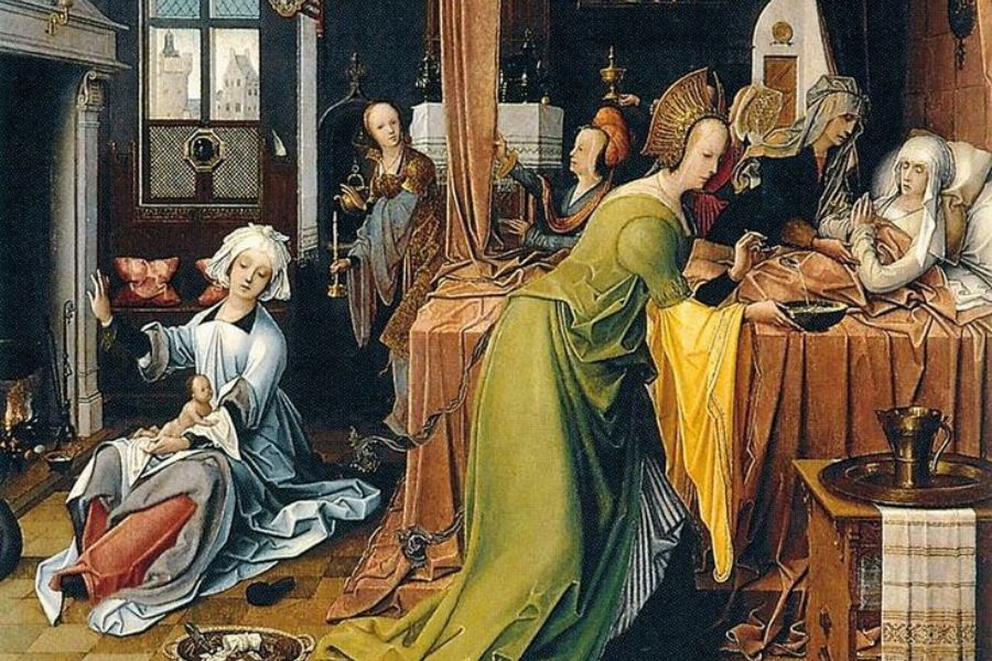 Medieval painting showing women attending a childbirth inside a richly furnished room while a newborn baby is bathed near a fireplace. Elaborate clothing, carved furniture, and domestic details illustrate childbirth and household life in the late medieval period.
