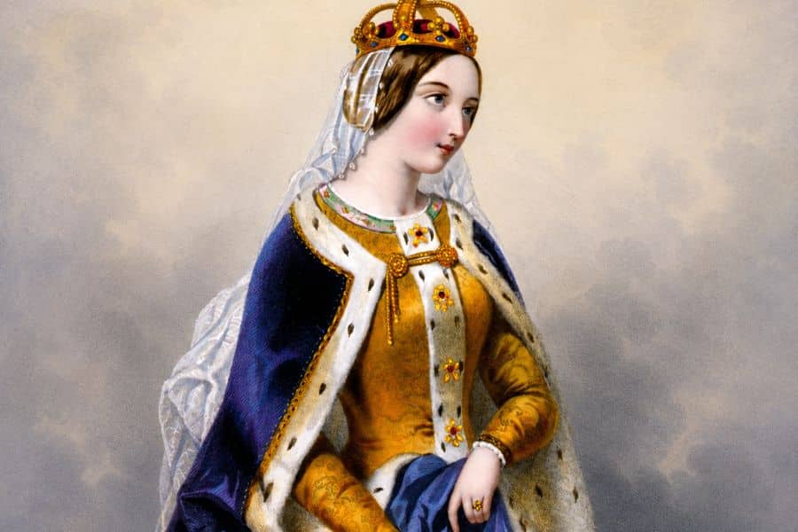 Painted portrait of Catherine of Valois wearing a jeweled crown, white veil and richly embroidered royal robes. Her elegant clothing and composed expression reflect her status as Queen of England and a prominent figure in medieval history.