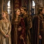 Three crowned noble couples stand inside a grand medieval hall wearing richly embroidered robes and ceremonial jewelry. Their tense expressions and formal pairings evoke the political alliances and family expectations tied to royal marriage.