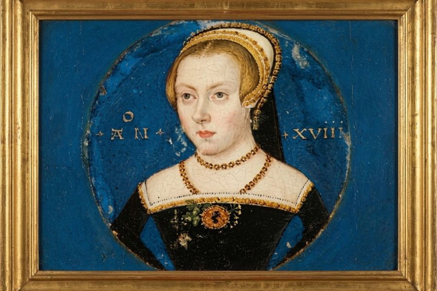 Framed painted portrait of a young Tudor era woman wearing a black dress with gold jewelry and a white and gold headdress against a vivid blue background. The portrait includes the text "AN XVII".